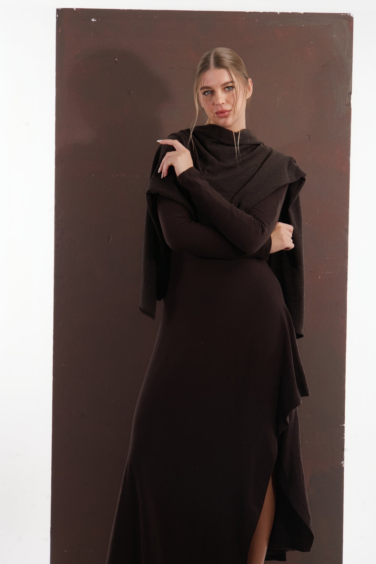 ALISADUDAJ brown wool open-back maxi dress, front view with shawl and arms crossed