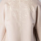 ALISADUDAJ CRAFT 01 beige cashmere coat, close-up of hand-embroidered scroll motif on the back, cashmere