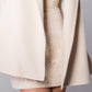 ALISADUDAJ CRAFT 01 beige cashmere mini skirt, close-up of tone-on-tone floral embroidery at the hip