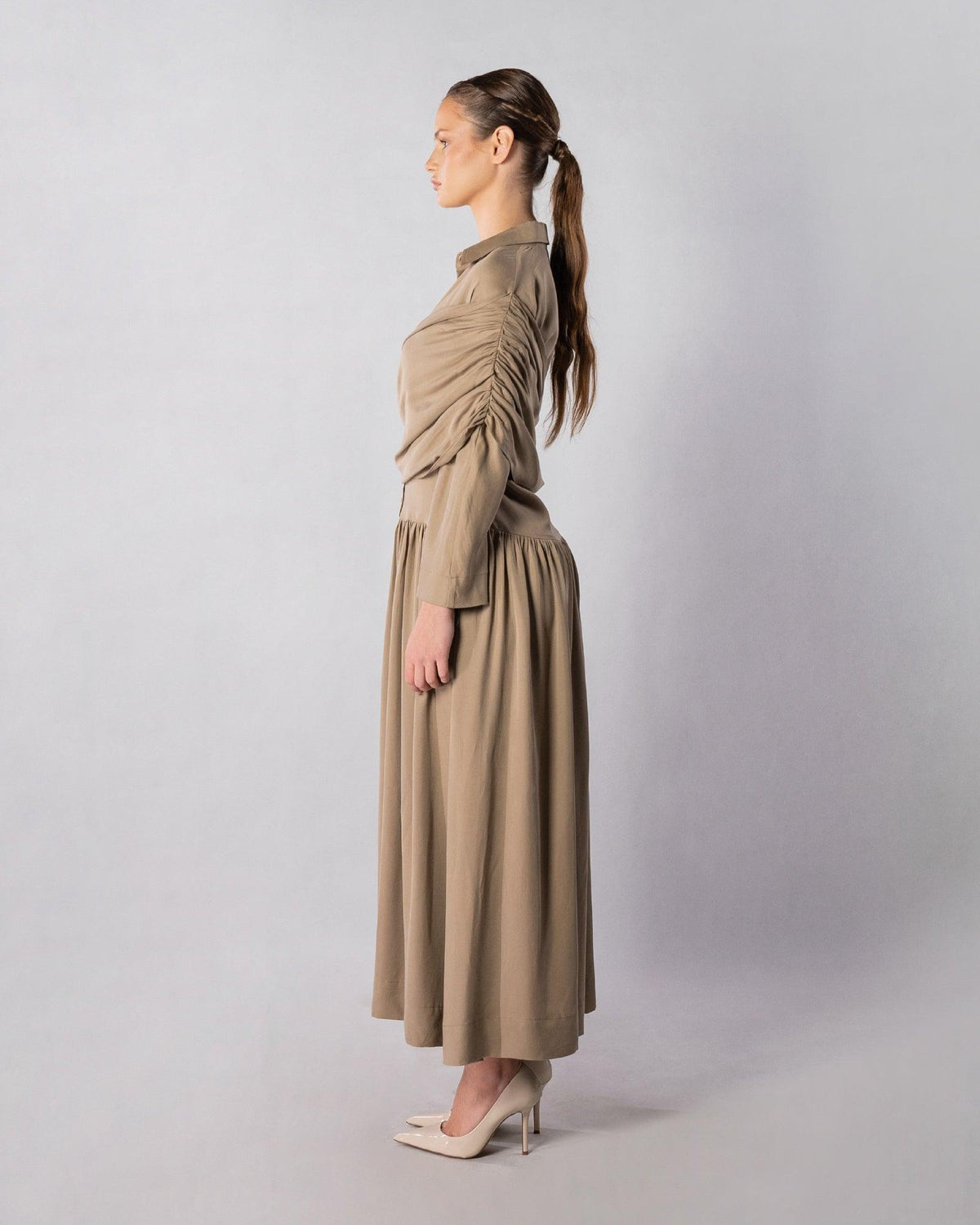 ALISADUDAJ CRAFT 02 brown cupro draped shirt dress, side profile showing ruched sleeve drape and drop-waist skirt
