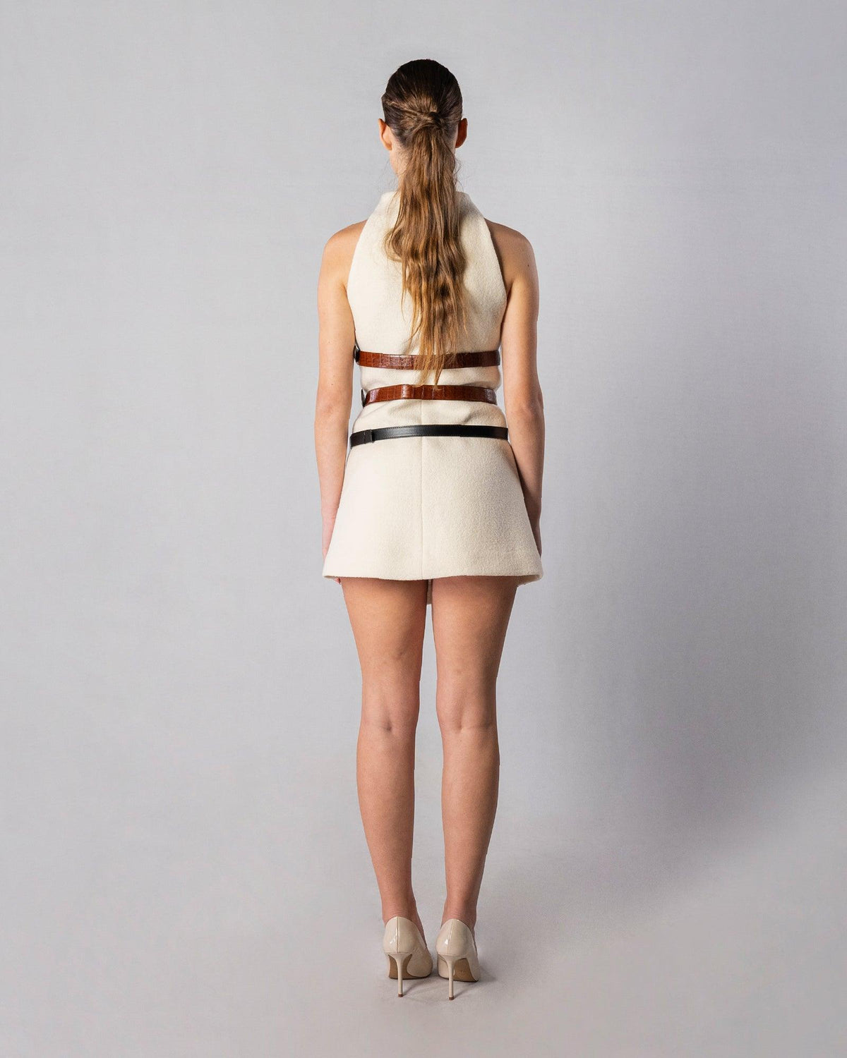 ALISADUDAJ CRAFT 03 white wool belted mini dress, back view showing funnel neck and belts, wool