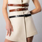 ALISADUDAJ CRAFT 03 white wool belted mini dress, close-up of two tan croc-effect belts, black belt and wrap panel