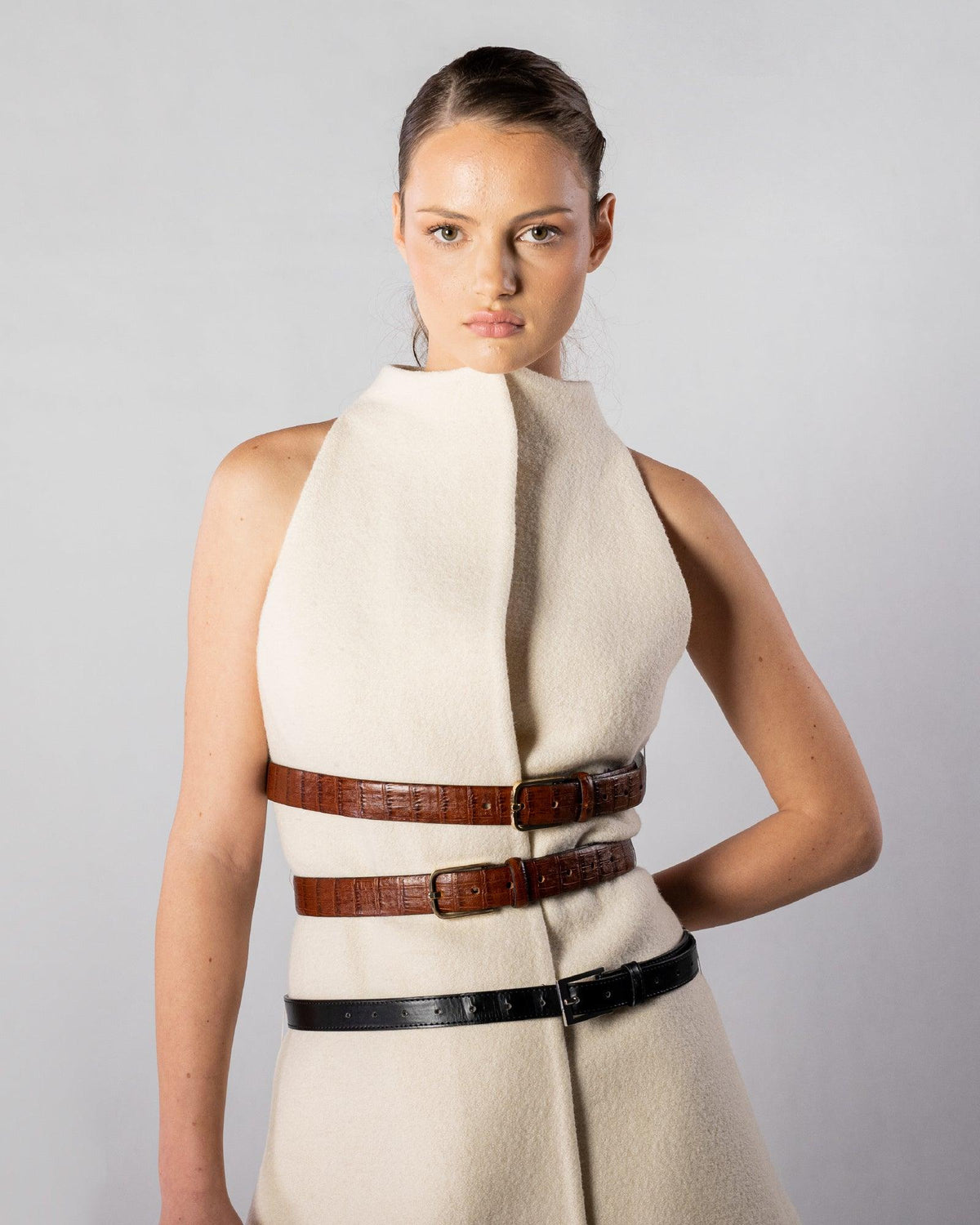 ALISADUDAJ CRAFT 03 white wool belted mini dress, front half-length view showing high funnel neck and stacked belts