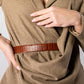 ALISADUDAJ CRAFT 04 brown wool draped wrap jacket, close-up of lapel, crossover drape and tan croc-effect belt