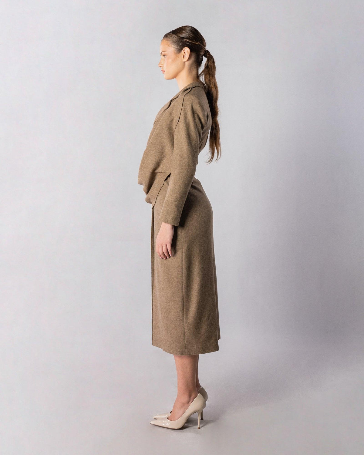 ALISADUDAJ CRAFT 04 brown wool draped wrap jacket and midi skirt set, side profile showing draped hip and straight skirt
