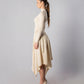 ALISADUDAJ CRAFT 07 off-white wool turtleneck and wrap skirt set, side profile showing handkerchief hem
