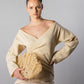 ALISADUDAJ CRAFT 08 off-white wool off-shoulder wrap top, half-length front view styled with the Çantro crochet clutch