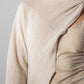 ALISADUDAJ CRAFT 09 off-white layered dress, close-up of draped knit overlay across the shoulder and suede bodice
