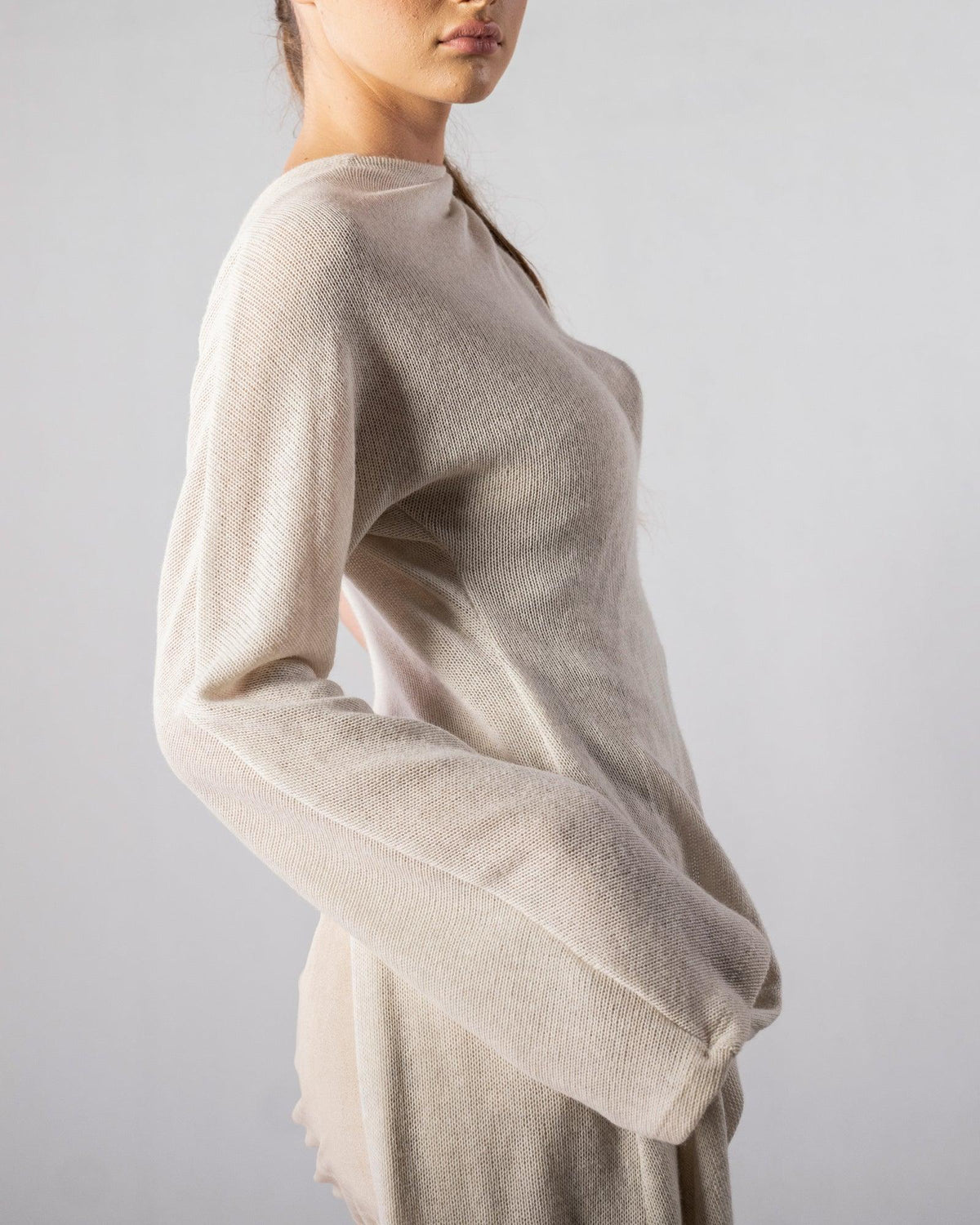 ALISADUDAJ CRAFT 09 off-white layered dress, close-up of wide knit sleeve cuff and fine wool texture