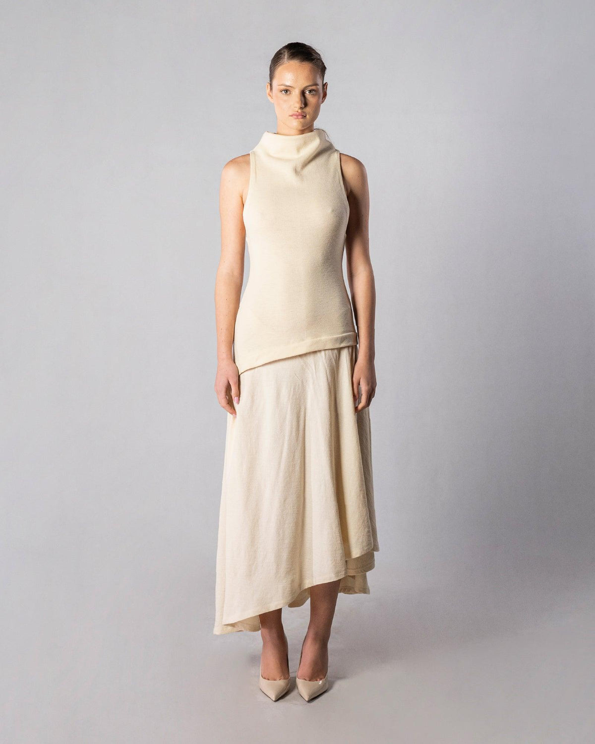 ALISADUDAJ CRAFT 10 off-white wool sleeveless funnel-neck top and asymmetric midi skirt set, front view, full length