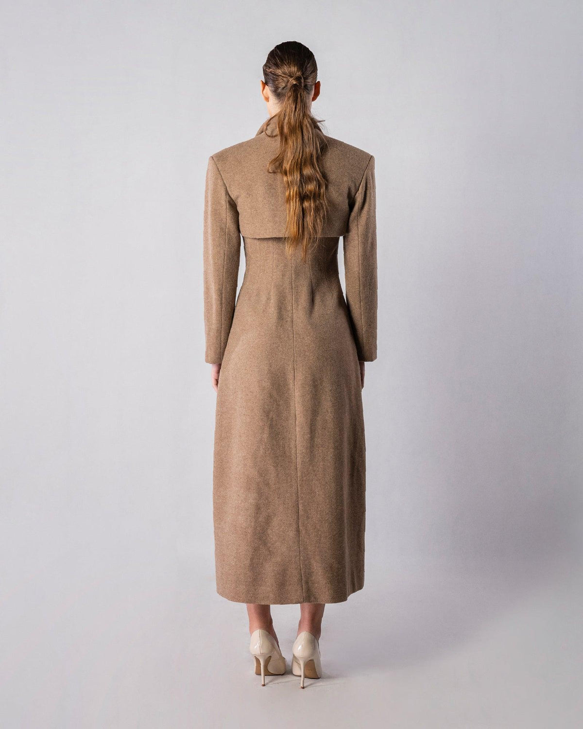 ALISADUDAJ CRAFT 11 brown wool longline coat, back view showing shoulder cape panel and centre seam