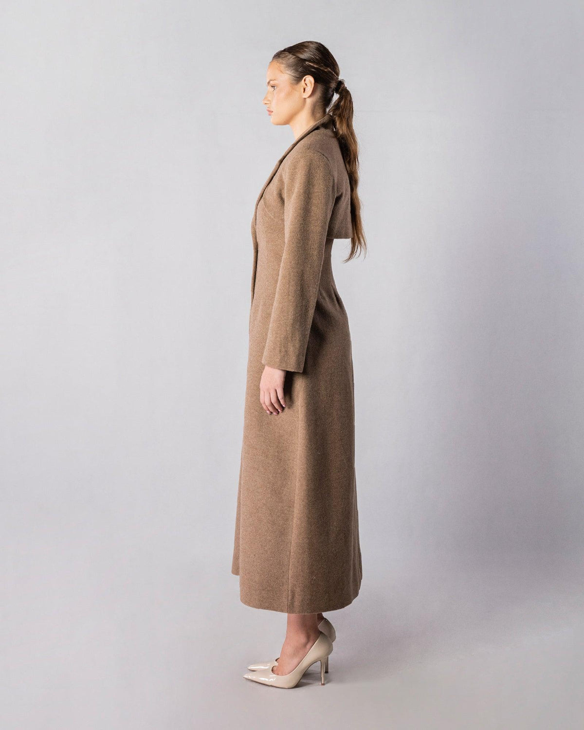 ALISADUDAJ CRAFT 11 brown wool longline coat, side profile showing tailored shoulder and full-length hem