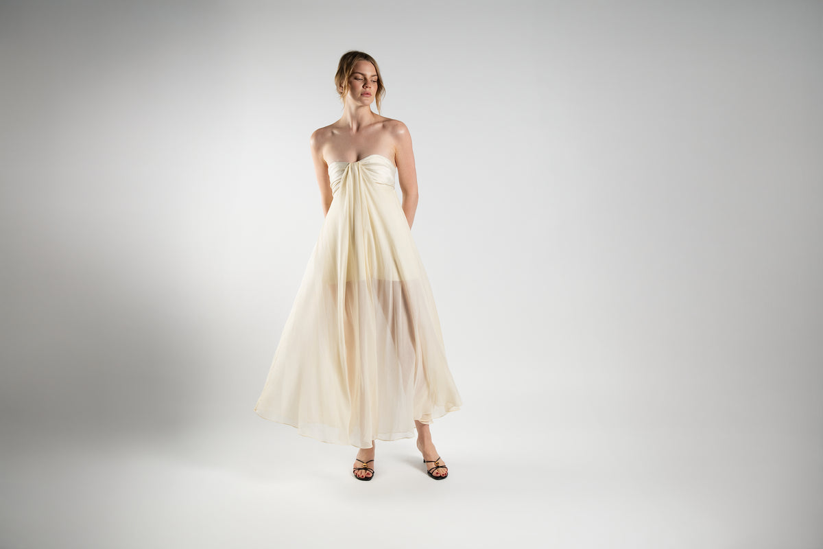 ALISADUDAJ cream linen and silk strapless maxi dress, front view showing empire bust and layered sheer overlay