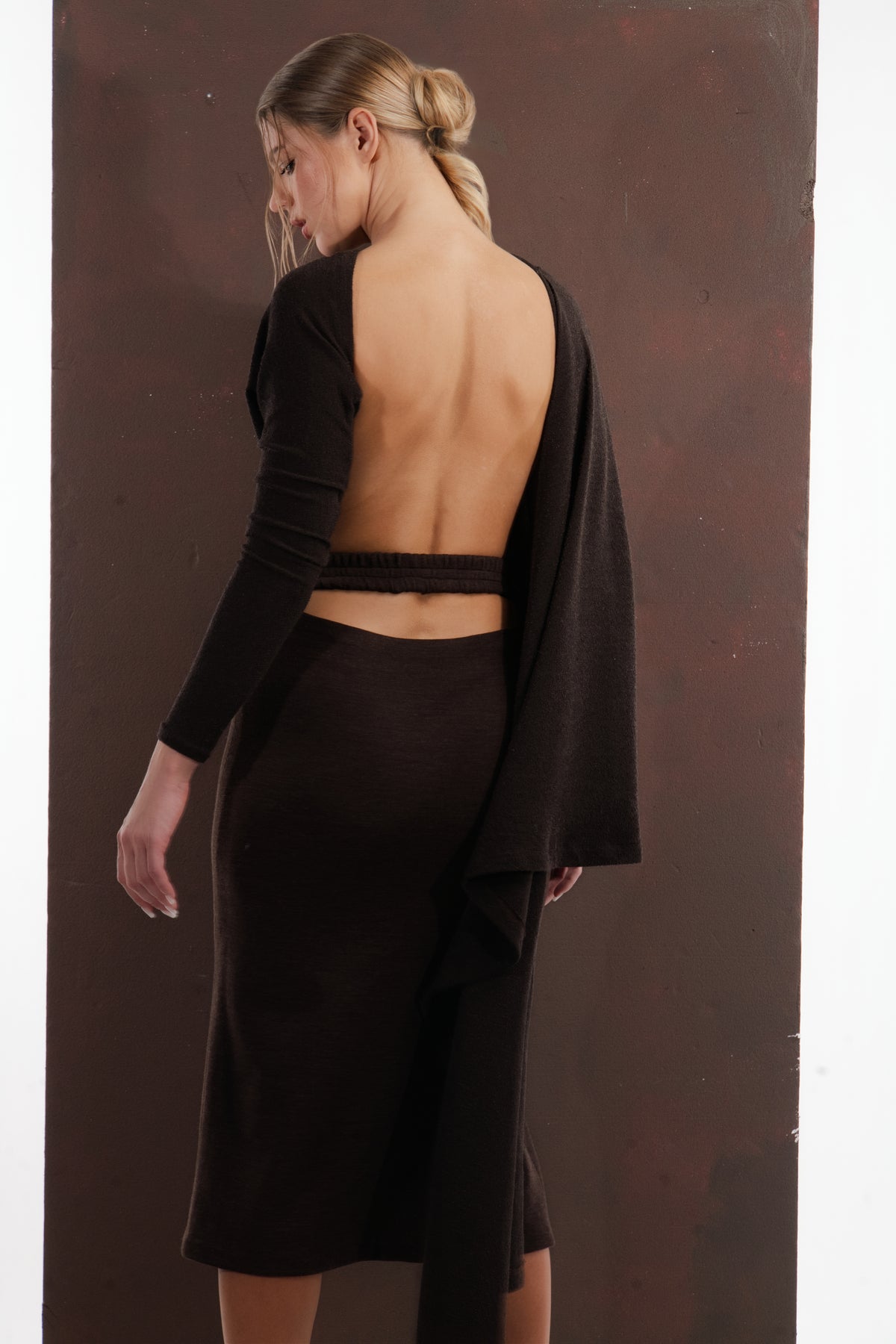 ALISADUDAJ dark brown wool draped set, back three-quarter view showing open back and pencil skirt