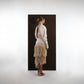 ALISADUDAJ ivory wool fringed dress, back view showing deep open back with braid trim and tiered fringe