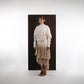ALISADUDAJ ivory wool fringed dress, front three-quarter view showing braid-trimmed neckline and fringe skirt