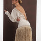 ALISADUDAJ ivory wool fringed dress, profile view showing open back, braid trim and tiered fringe skirt