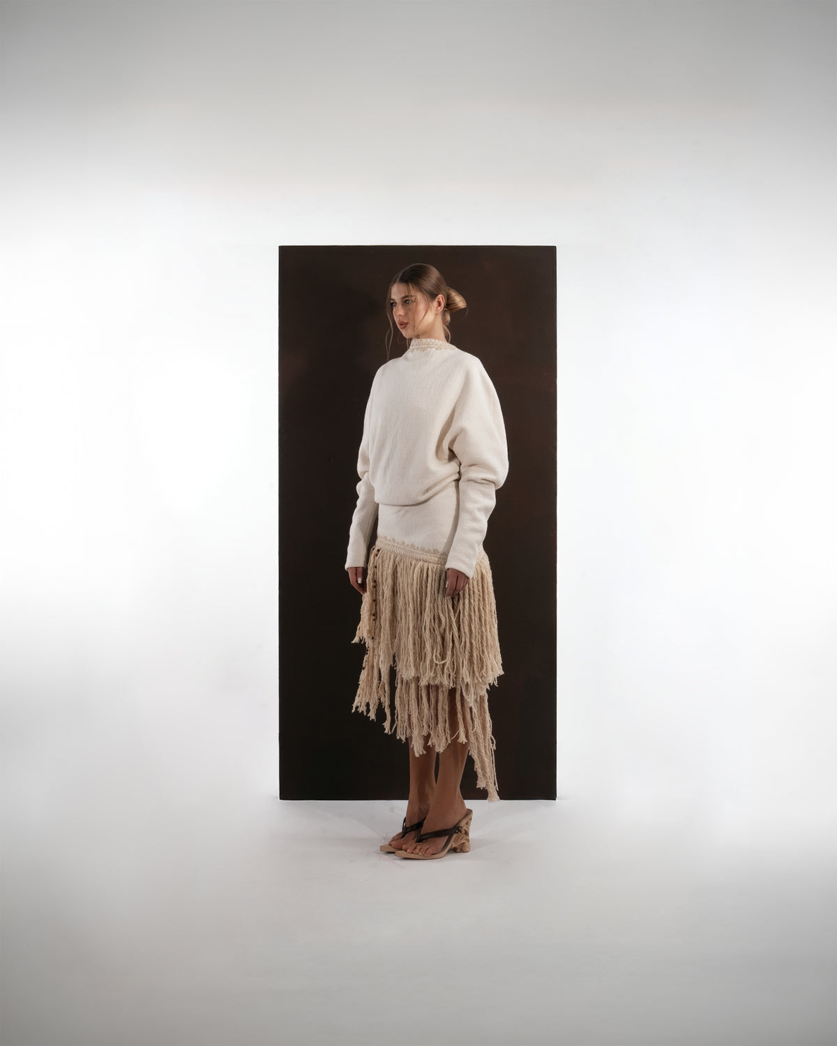 ALISADUDAJ ivory wool fringed dress, side view showing dropped waist and two-tier fringe skirt