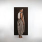 ALISADUDAJ ivory and grey wool beaded hooded vest and draped trouser set, back three-quarter view looking over shoulder
