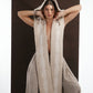 ALISADUDAJ ivory wool beaded hooded vest, front close-up with hood up and hands behind neck