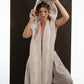 ALISADUDAJ ivory wool beaded hooded vest, close-up of jacquard-patterned hood held open with one hand