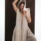 ALISADUDAJ ivory wool beaded hooded vest, close-up with hood pulled forward as a veil, beaded cord in hand
