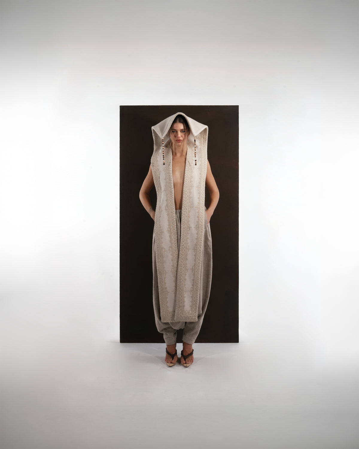 ALISADUDAJ ivory and grey wool beaded hooded vest and draped trouser set, front view, full length with hood up