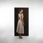 ALISADUDAJ ivory and grey wool red-embroidered dress, back three-quarter view showing bodice and flared skirt