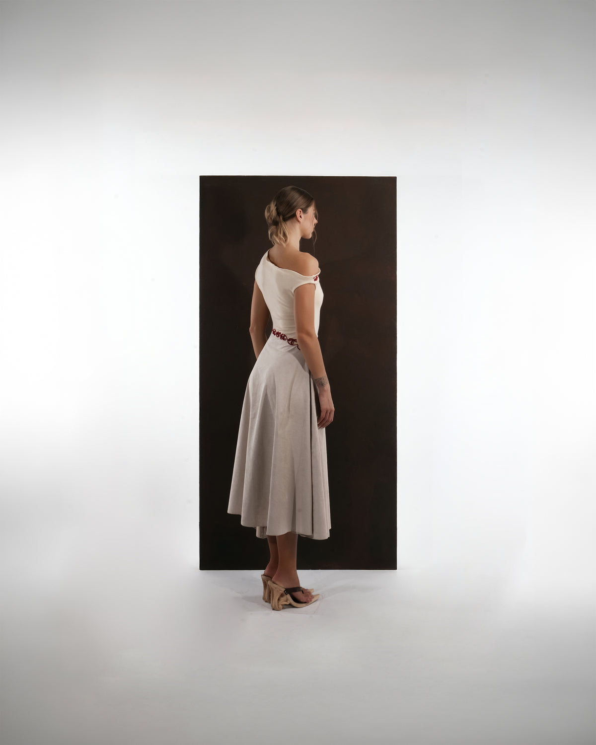 ALISADUDAJ ivory and grey wool red-embroidered dress, back three-quarter view showing bodice and flared skirt
