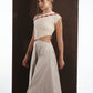 ALISADUDAJ ivory and grey wool red-embroidered dress, side close-up of red embroidery and waist cut-out, wool and elastane