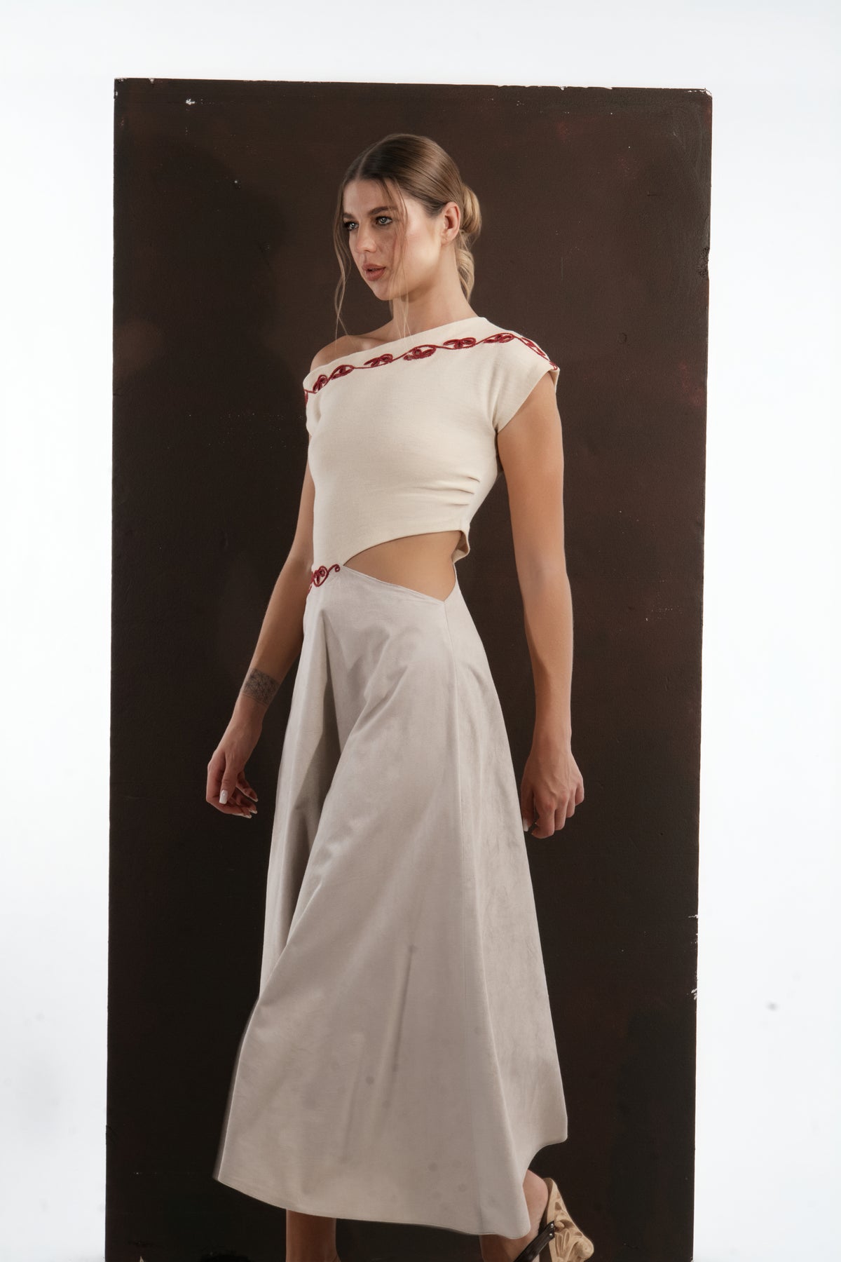 ALISADUDAJ ivory and grey wool red-embroidered dress, side close-up of red embroidery and waist cut-out, wool and elastane