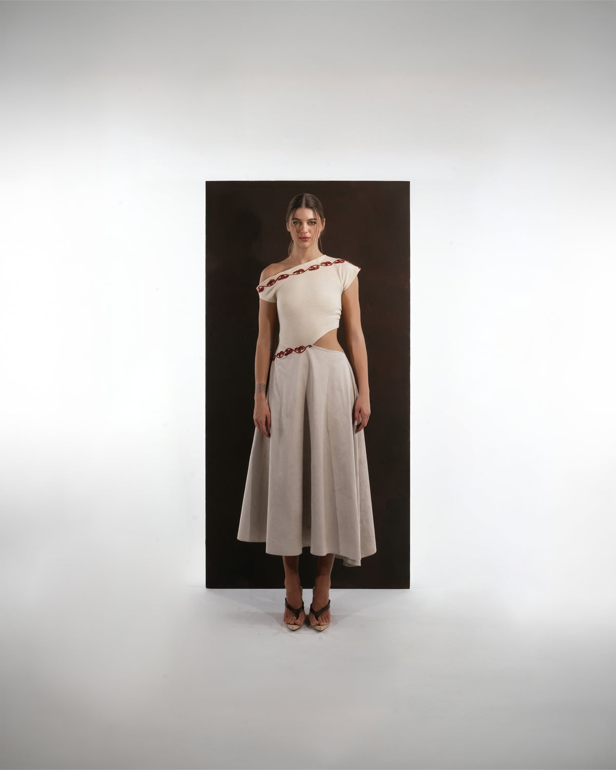 ALISADUDAJ ivory and grey wool red-embroidered dress, front view showing off-shoulder neckline and full midi skirt