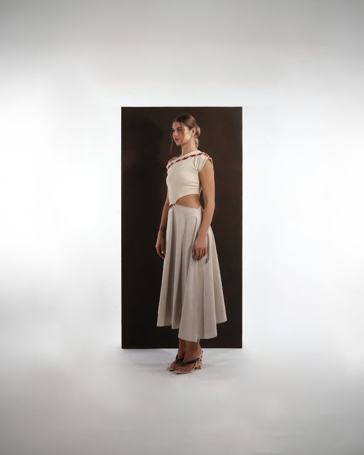 ALISADUDAJ ivory and grey wool red-embroidered dress, side three-quarter view showing waist cut-out