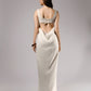 ALISADUDAJ ivory linen empire-waist gown, back view showing lace-up bodice tie and open back