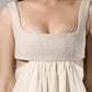 ALISADUDAJ ivory linen empire-waist gown, close-up of woven bodice band and gathered skirt seam