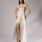 ALISADUDAJ ivory linen empire-waist gown, front view with hand on hip showing high front slit