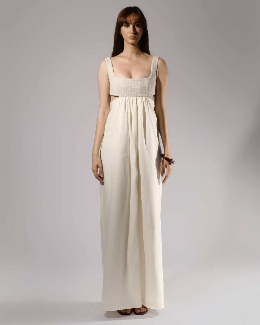ALISADUDAJ ivory linen empire-waist gown, front view, full length, showing textured bodice and gathered skirt