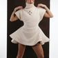 ALISADUDAJ ivory ribbed wool flared mini dress, front close-up of ribbed knit, cut-out motif and flared hem, wool blend