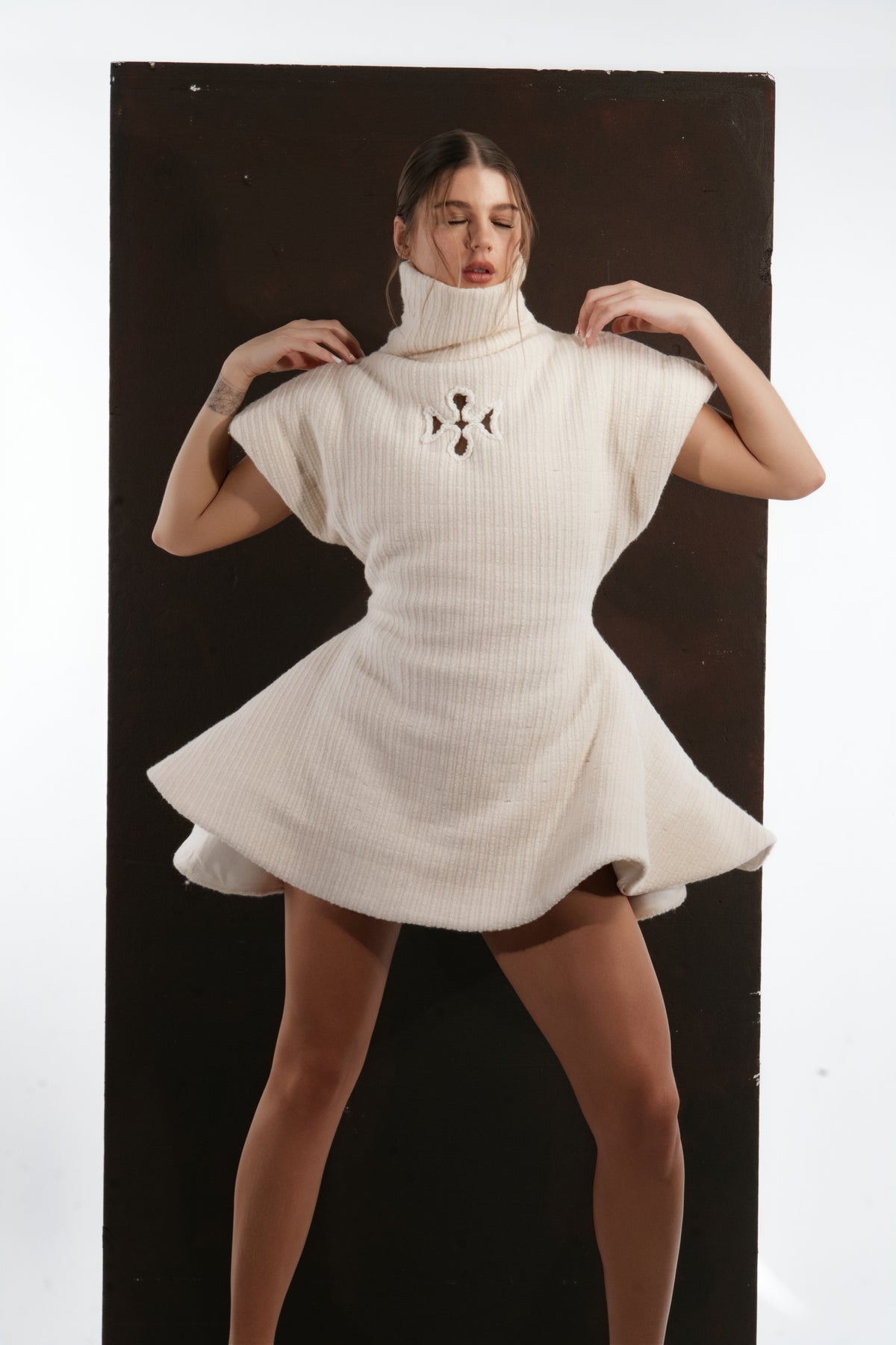 ALISADUDAJ ivory ribbed wool flared mini dress, front close-up of ribbed knit, cut-out motif and flared hem, wool blend