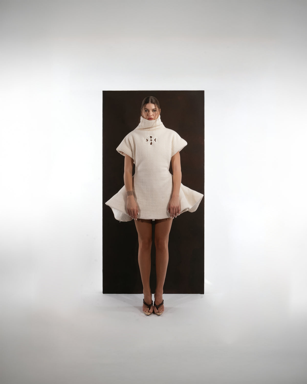 ALISADUDAJ ivory ribbed wool flared mini dress, front view showing circular flared hem