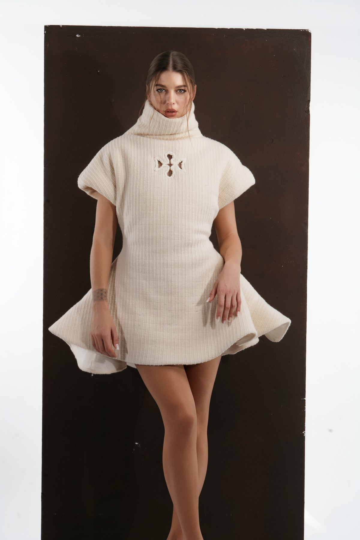 ALISADUDAJ ivory ribbed wool flared mini dress, three-quarter view showing cut-out detail at the chest