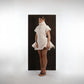 ALISADUDAJ ivory ribbed wool flared mini dress, front three-quarter view showing rib texture and hem volume