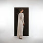 ALISADUDAJ ivory wool draped asymmetric set, back view showing draped panel down the back and long sleeve