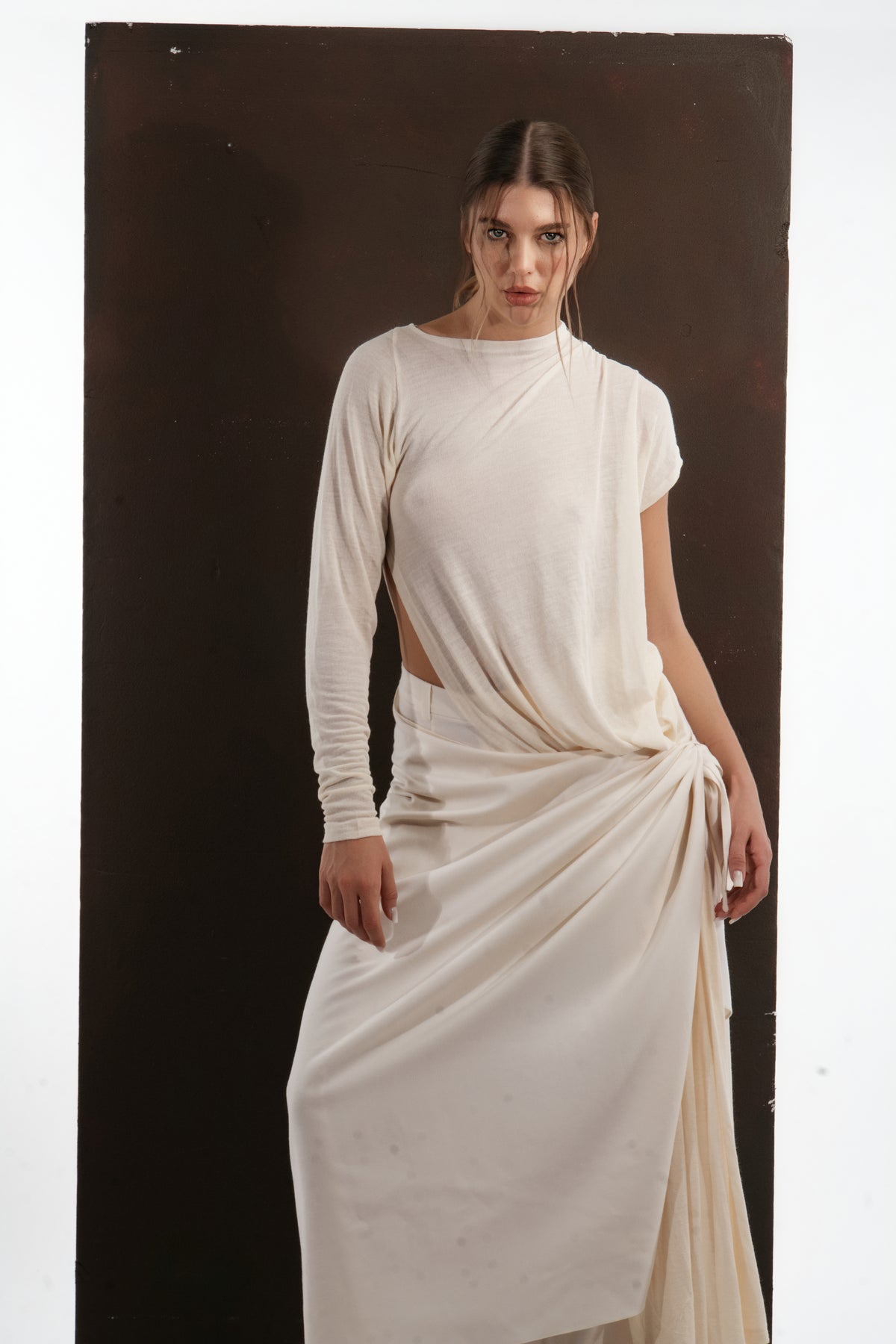 ALISADUDAJ ivory wool draped asymmetric set, half-length view showing knotted drape at the hip