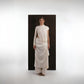 ALISADUDAJ ivory wool draped asymmetric set, front view showing gathered waist drape and layered hem