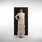 ALISADUDAJ ivory wool draped asymmetric set, front view with hand on hip showing one long sleeve and one cap sleeve