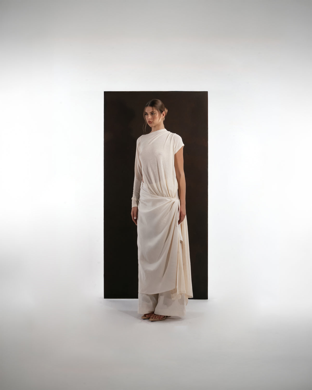 ALISADUDAJ ivory wool draped asymmetric set, side three-quarter view, full length