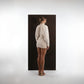 ALISADUDAJ ivory wool draped mini dress, back view showing fitted body and gathered raglan sleeves