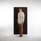 ALISADUDAJ ivory wool draped mini dress, side three-quarter view showing high neck and sleeve drape