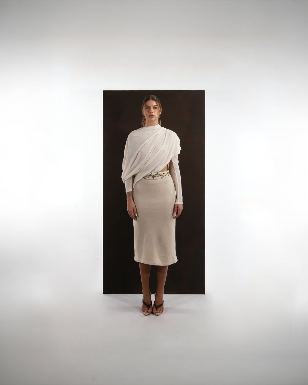 ALISADUDAJ ivory wool draped top and embroidered-waist midi skirt set, front view showing cowl drape across the chest